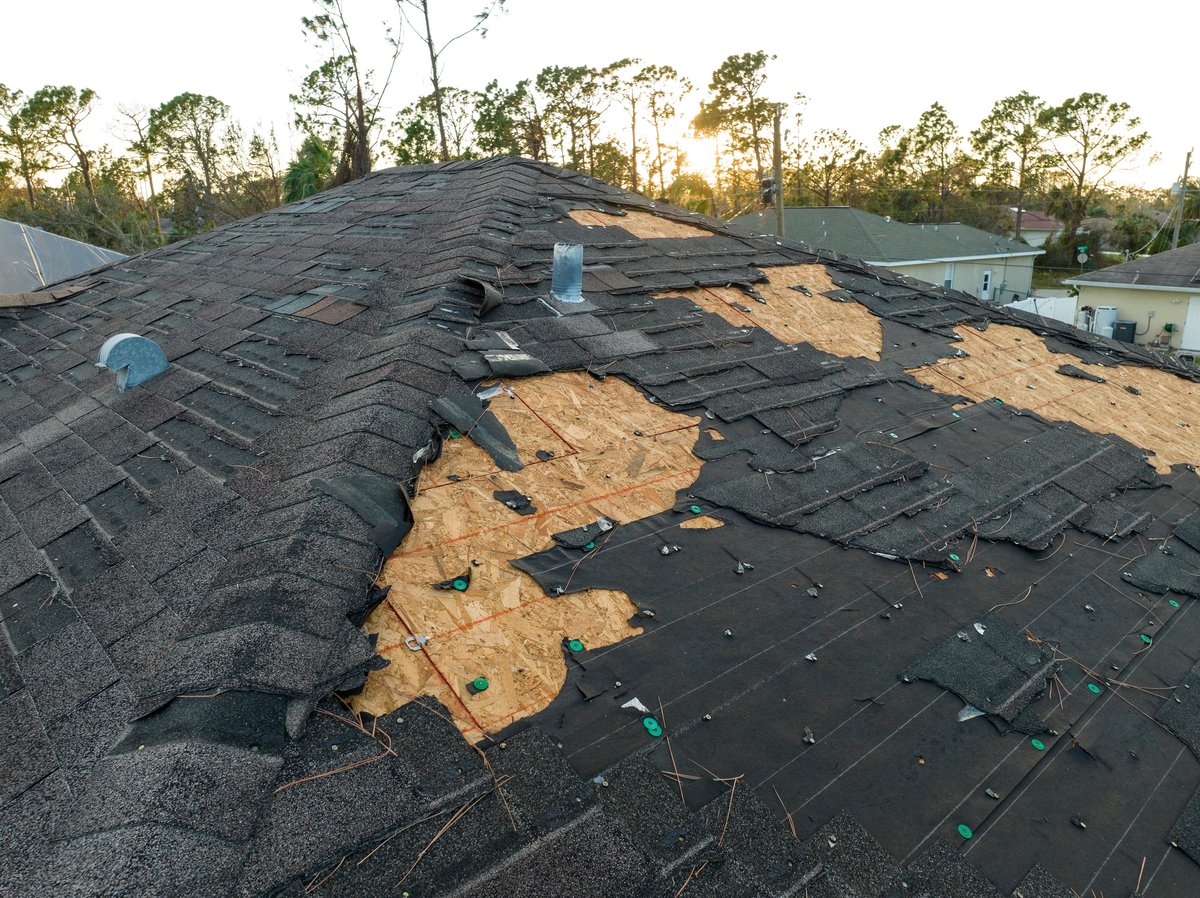 Storm-damaged roof after a hurricane in Florida
