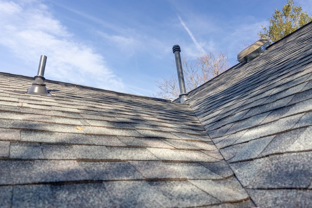 Roof area around a chimney where flashing often leaks