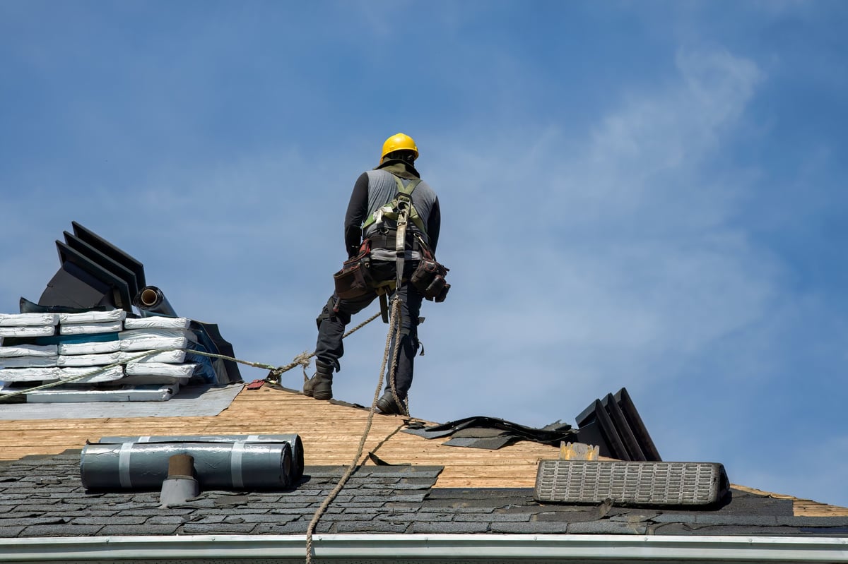 Construction crew installing residential roofing near Fort Myers